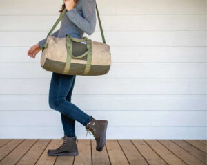 Girl Carrying Duffle Bag